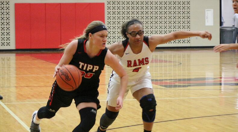 Allison Mader (left), driving against Trotwood-Madison’s Myla Barnes (2). Tippecanoe won a GWOC North title for the third consecutive season. Contributed / Greg Billing