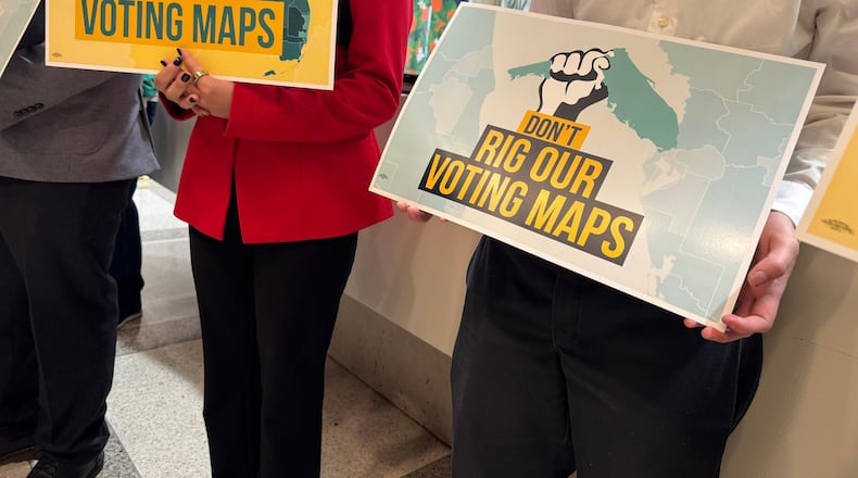 Opponents of mid-decade efforts to redraw congressional voting districts gather to protest in the Florida Capitol in Tallahassee, Fla., Dec. 2, 2025. (AP Photo/Kate Payne)