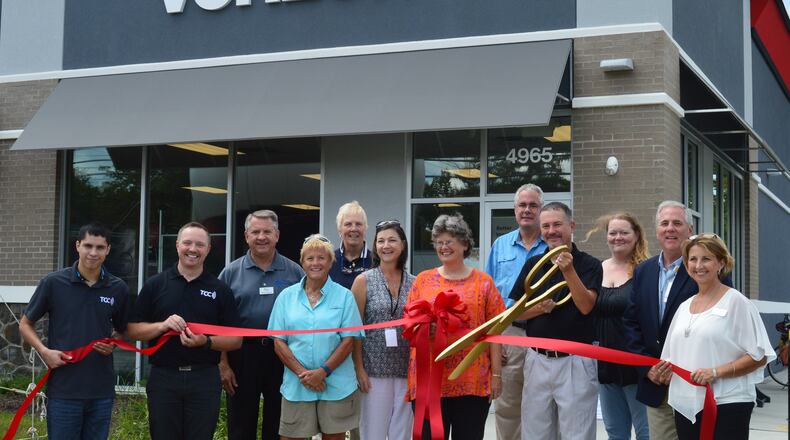 A ribbon cutting at a new Verizon store at 4965 College Corner Pike in August. CONTRIBUTED