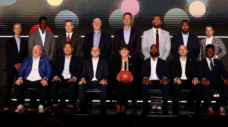 Men's basketball coaches, including Dayton's Anthony Grant, top, second from left, pose for a photo at Atlantic 10 Conference Media Day on Tuesday, Sept. 30, 2025, in Pittsburgh. David Jablonski/Staff