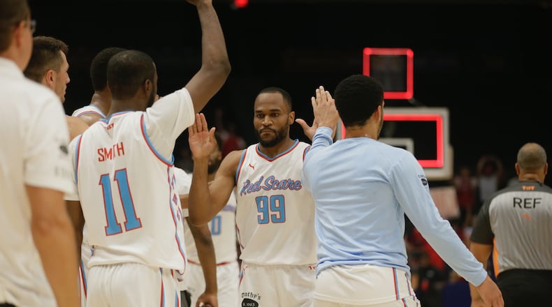 The Red Scare's Vee Sanford returns to the bench after making a 3-pointer at the end of the first half against the Golden Eagles in The Basketball Tournament on Wednesday, July 27, 2022, at UD Arena. David Jablonski/Staff
