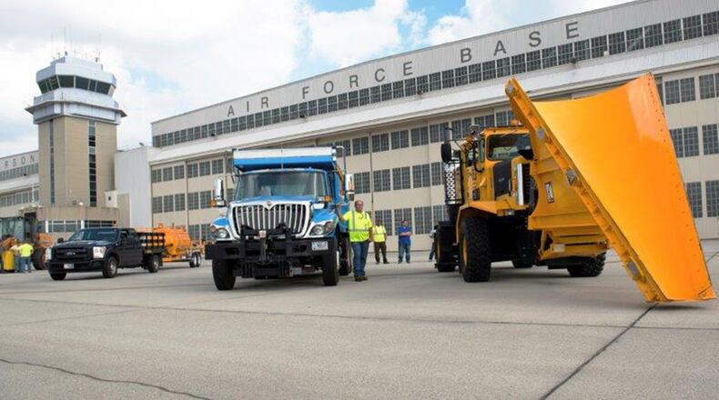 The 88th Civil Engineering Group heavy equipment and grounds crew park along the flightline after the annual Snow Parade at Wright-Patterson Air Force Base Oct. 3. (U.S. Air Force photo/Michelle Gigante)