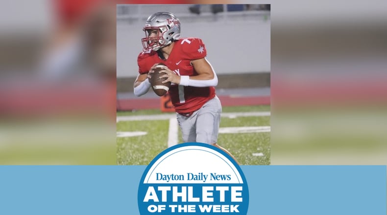Troy High School senior quarterback Aiden Kirkpatrick rolls out to pass during a recent game for the Trojans. TROY CITY SCHOOLS / CONTRIBUTED PHOTO