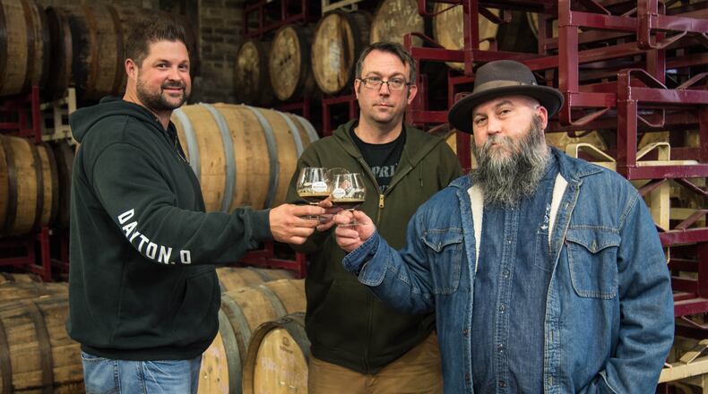 Warped Wing Brewing Co. and the Century Bar have partner for Kette's Pride. The rye whiskey barrel aged porter will be the only beer sold in Kette's Kandies Spirited Treats, a planned speakeasy behind The Century Bar. Century Bar co-owner Joe Head (far right) is pictured with Nick Bowman and John Haggerty of Warped Wing. Photo submitted by Warped Wing.