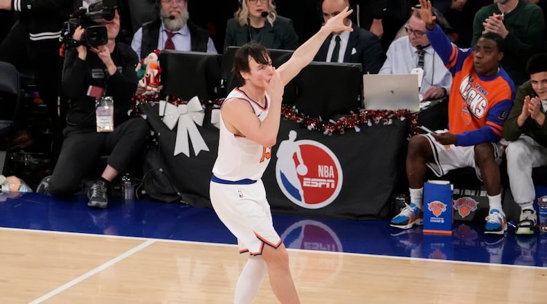 New York Knicks guard Tyler Kolek (13) reacts after scoring a three point goal during the second half of an NBA basketball game against the Cleveland Cavaliers, Thursday, Dec. 25, 2025, in New York. (AP Photo/Yuki Iwamura)