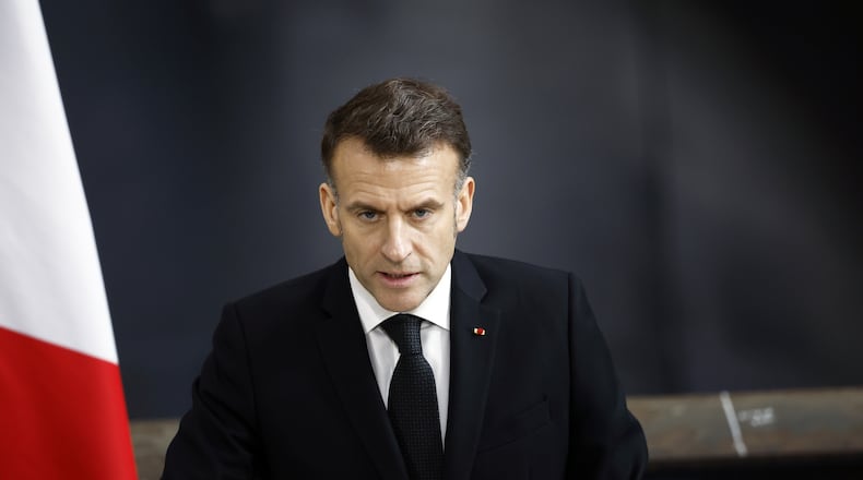 French President Emmanuel Macron delivers a speech next to the submarine 'Le Temeraire' (The Temerarious) at the Nuclear submarines Navy base of Ile Longue in Crozon, France, Monday March 2, 2026. (Yoan Valat/Pool Photo via AP)