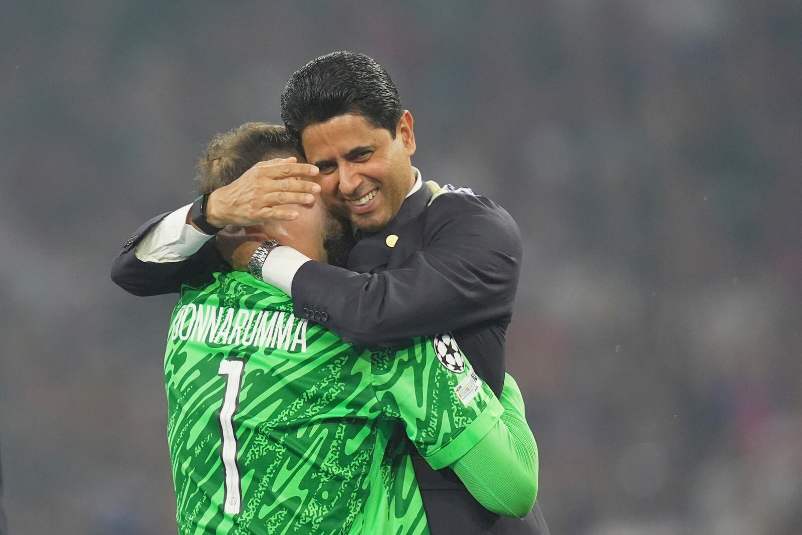 PSG's goalkeeper Gianluigi Donnarumma embraces PSG's President Nasser Al-Khelaifi after the Champions League Final soccer match between Paris Saint Germain and Inter at the Allianz Arena in Munich, Germany, Saturday May 31, 2025 . (Spada/LaPresse via AP)