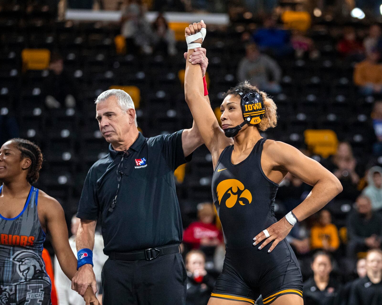 FILE - Iowa's Kennedy Blades is declared the winner after wrestling Indiana Tech's Cydney Bassett at 160 pounds during Day 1 of the Soldier Salute wrestling tournament at the Xtream Arena in Coralville, Iowa, on Dec. 29, 2024. (Nick Rohlman/The Gazette via AP, File)