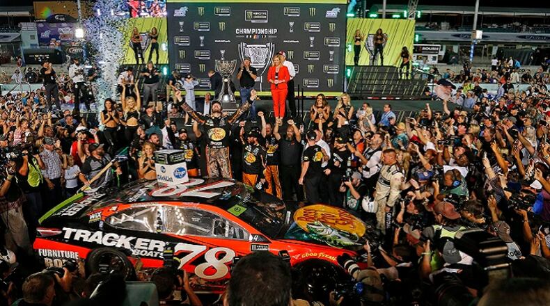 Martin Truex Jr., celebrates as he wins the Monster Energy NASCAR Cup Series Championship and EcoBoost 400 on Sunday, Nov. 19, 2017 at the Homestead-Miami Speedway in Homestead, Fla. (Carl Juste/Miami Herald/TNS)