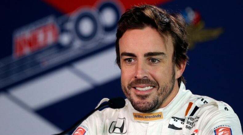 Fernando Alonso of Spain talks about practicing for the first time at the Indianapolis Motor Speedway in Indianapolis, Wednesday, May 3, 2017. Alonso plans to miss the Monaco Grand Prix this year to drive in the Indianapolis 500. (AP Photo/Michael Conroy)