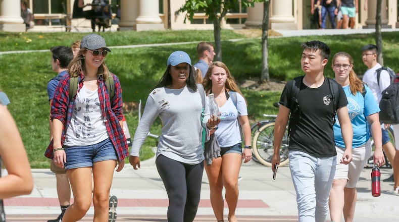 Students walk to classes on the Miami University campus in Oxford.