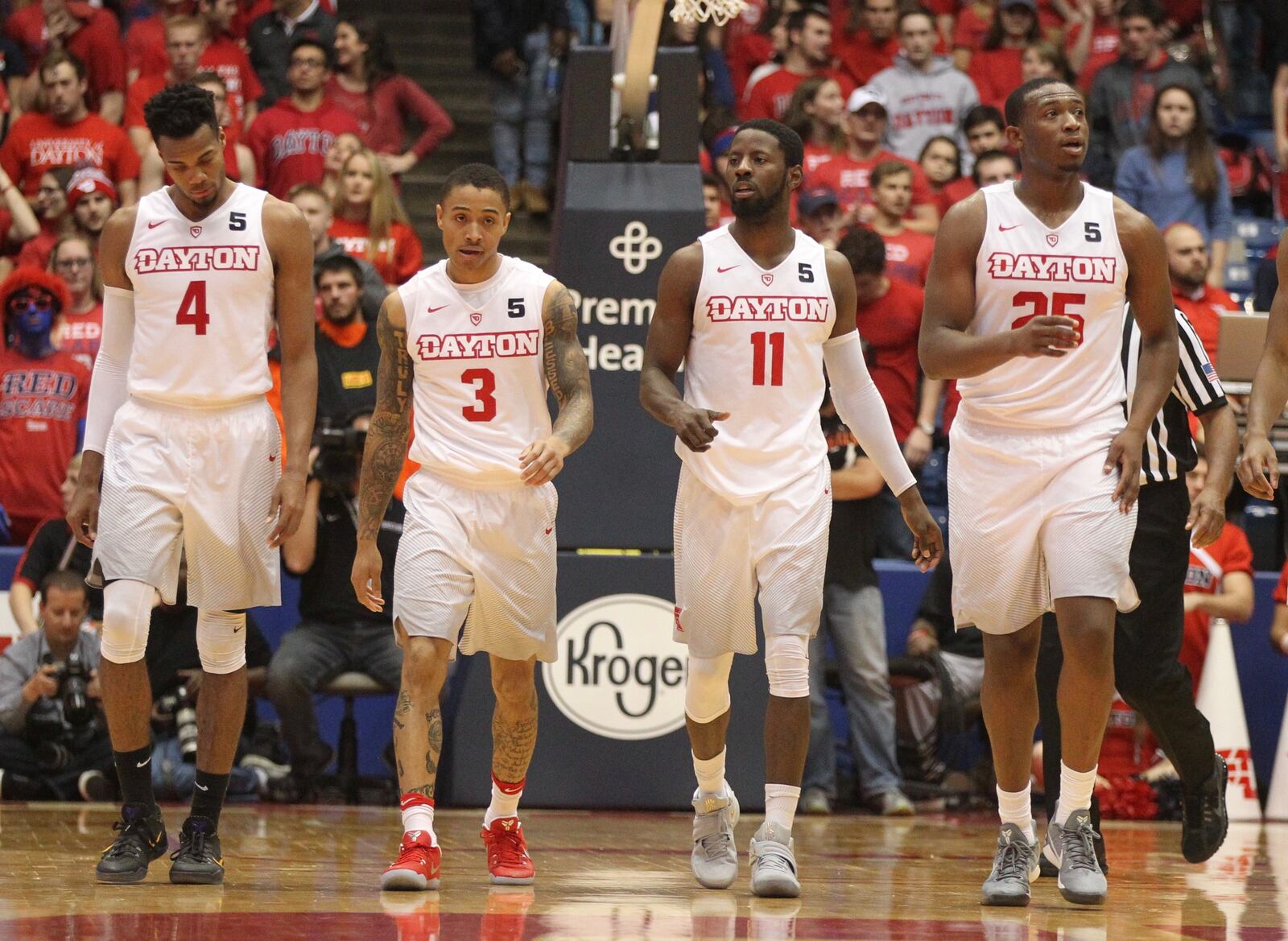 Dayton seniors Charles Cooke, Kyle Davis, Scoochie Smith and Kendall Pollard head up up the court after a defensive stop against Winthrop on Saturday, Dec. 3, 2016, at UD Arena in Dayton. David Jablonski/Staff