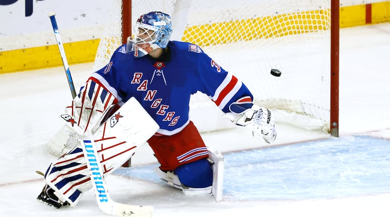 A puck shot by Anaheim Ducks left wing Cutter Gauthier (not shown) gets by New York Rangers goaltender Igor Shesterkin for a goal during the third period of an NHL hockey game, Monday, Dec 15, 2025, in New York. (AP Photo/Noah K. Murray)