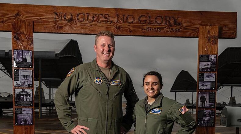 Maj. Nick Harris (left) and Capt. Jessica Wallander, instructor pilots with the 71st Flying Training Wing at Vance Air Force Base, Okla., stand side-by-side to illustrate the varying standing heights of Air Force pilots to dispel the myth that there is one height standard for all Air Force pilots. Height waivers are available for candidates that do not meet AFI 48-123 standards. (U.S. Air Force courtesy photos)