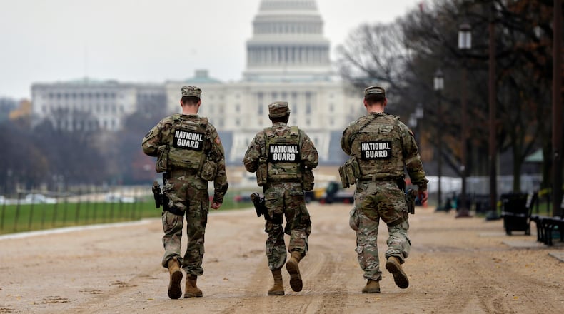 National Guard patrol along the National Mall in front of the Capitol, Wednesday, Nov. 26, 2025, in Washington. (AP Photo/Rahmat Gul)