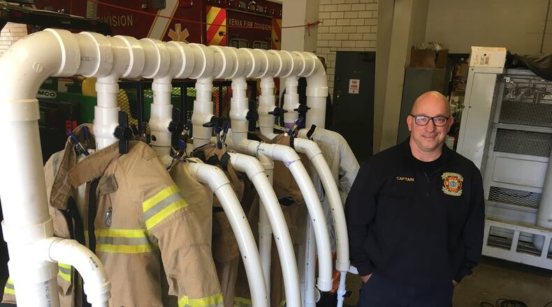 Xenia Fire Capt. Jeff Bruggeman and other Xenia firefighters built a system that will dry fire gear quickly. The apparatus helps Xenia firefighters have clean, dry gear to go on runs, as national guidelines advise washing gear after every fire to help prevent cancer. RICHARD WILSON/STAFF