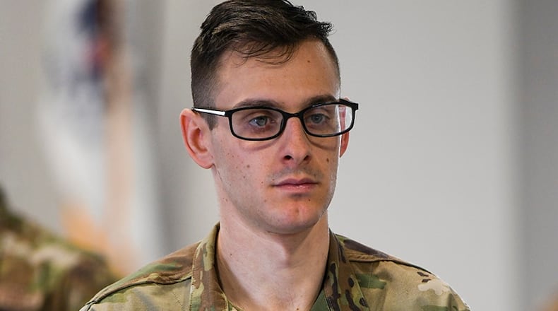 Senior Airman Steven Elgowsky, 445th Civil Engineer Squadron engineering aide and member of the Wright-Patterson Air Force Base Honor Guard, practices folding a flag during ceremonial guardsman training March 16. U.S. AIR FORCE PHOTO/MASTER SGT. PATRICK O’REILLY