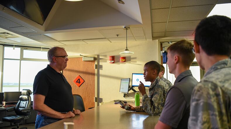 Mike Peterson, Wright-Patterson Air Force Base’s airfield management shift lead, gives a brief description of his duties to cadets from the Civil Air Patrol’s 037 Wright-Patterson Composite Squadron on June 29. The cadets got a tour of what happens behind the scenes at the Base Operations Building. U.S. AIR FORCE PHOTO/AIRMAN 1ST CLASS ALEXANDRIA FULTON