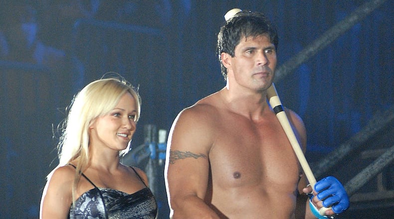 YOKOHAMA, JAPAN - MAY 26: Former Oakland Athletics slugger Jose Canseco (R) and Heidi Northcott walk to the ring with holding a bat prior to the match with Choi Hong-man at first Round of Super Hulk Tournament during Dream.9 at Yokohama Arena on May 26, 2009 in Yokohama, Kanagawa, Japan. Canseco lost at 1 minute 17 seconds in the first round. (Photo by Hiroki Watanabe/Getty Images)