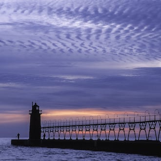 “Sunset at the Pier” taken in Michigan by the late Bro. John Lemker, who has art exhibiting in April at Ed Dixon Gallery. CONTRIBUTED