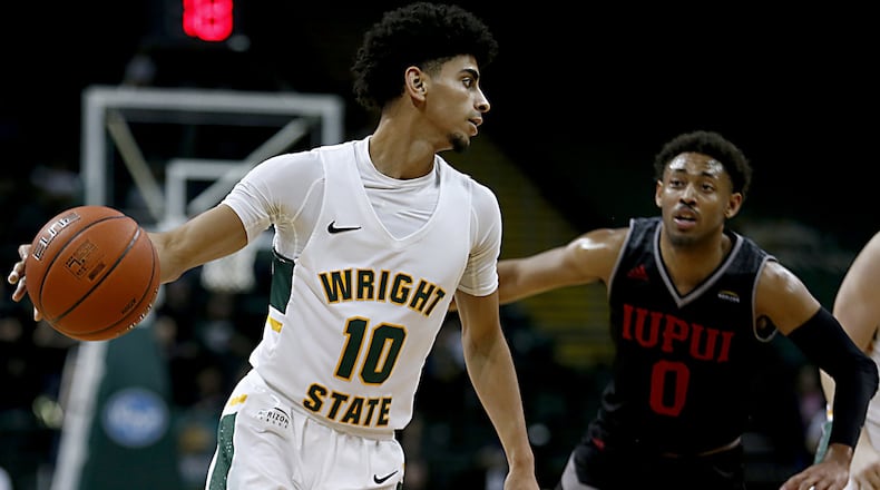 Wright State University guard Trey Calvin is covered by IUPUI guard Jaylen Minnett during their Horizon League game at the Nutter Center in Fairborn Sunday, Feb. 16, 2020. Wright State won 106-66. Contributed photo by E.L. Hubbard