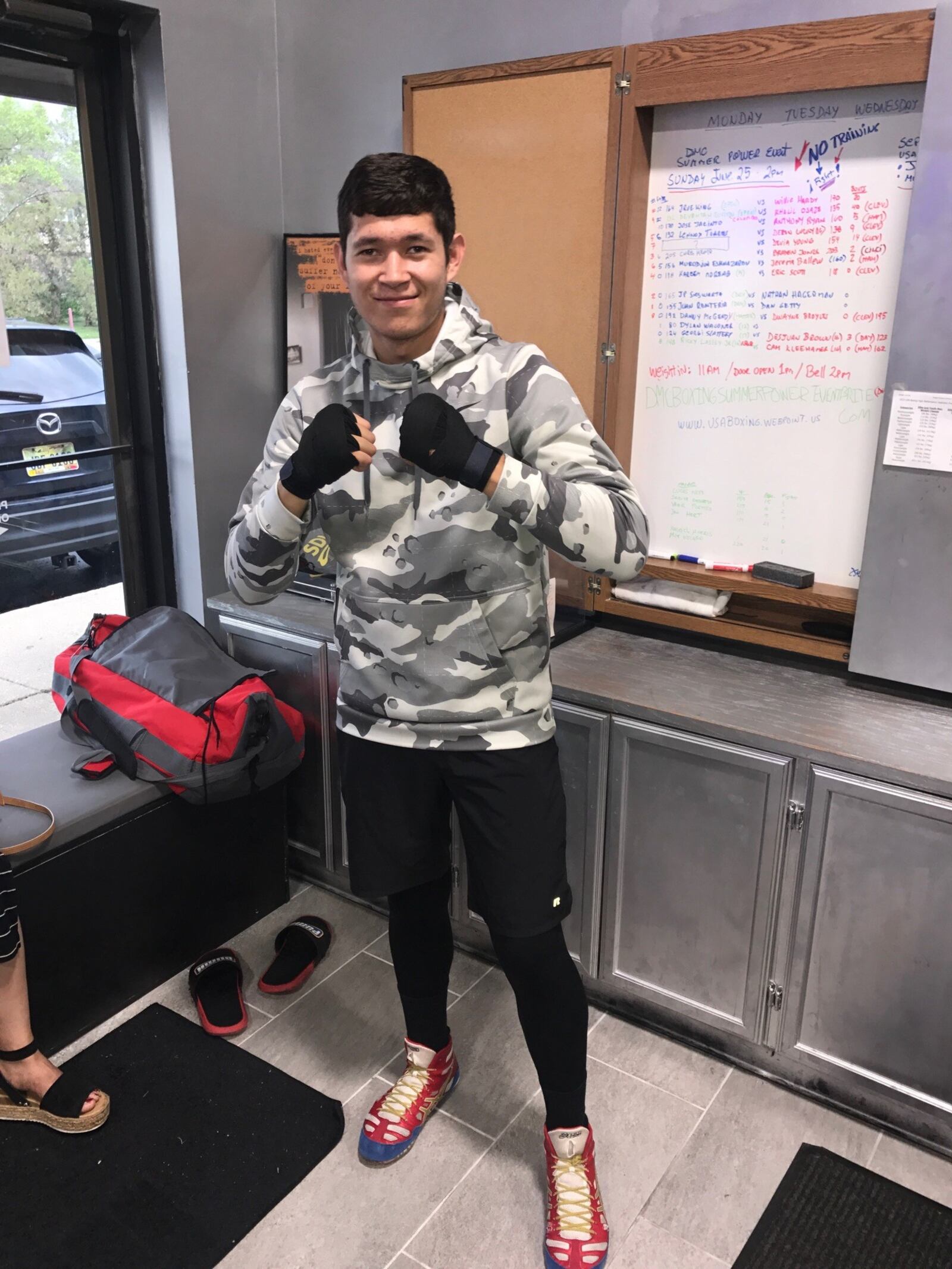 Murodjon Eshnazarov, an 18-year-old middleweight who came to the U.S. from Uzbekistan two years ago, gets ready to train Monday evening at the DMC Boxing Academy. He won a decision over Hamilton’s Jeremy Ballew, Sunday at the Summer Power boxing show at DMC. A recent grad of Kings High School, Eshnazarov is headed to the University of Cincinnati in the fall. Tom Archdeacon/CONTRIBUTED