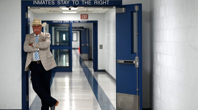 Butler County Sheriff Richard Jones has taken a hard stance on immigration since taking office more than two decades ago. He had 10 deputies credentialed to serve as ICE agents in the county, and said he plans to have more deputies eventually go through the training. Pictured is Jones in the hallway of the Butler County Jail on Wednesday, June 9, 2025. MICHAEL D. PITMAN/STAFF