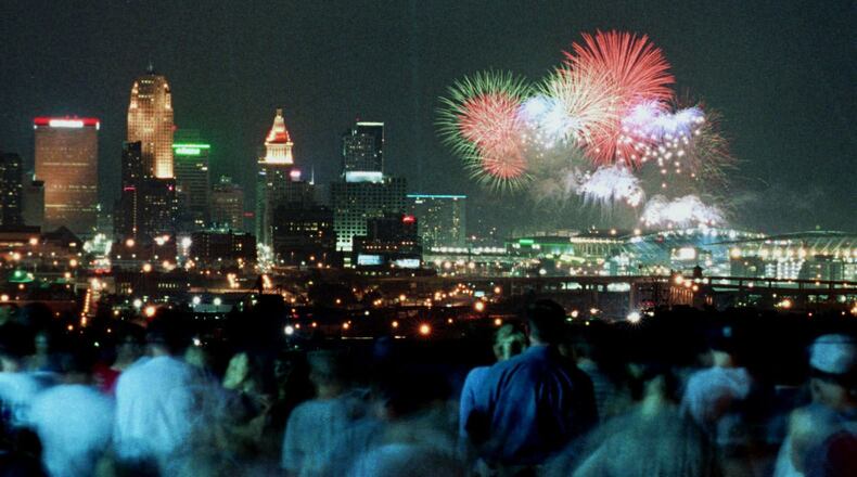 Crowds watch a past Riverfest fireworks from a park overlooking downtown Cincinnati. ASSOCIATED PRESS