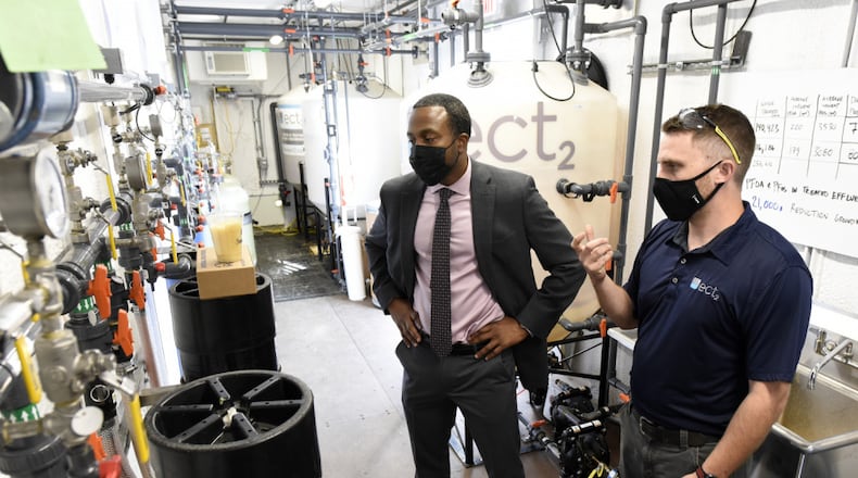Amir Mott, left, deputy director, 88th Civil Engineer Group, tours a pilot remediation operation with Dan Casey, lead field operations engineer, Emerging Compounds Treatment Technologies, at Wright-Patterson Air Force Base on Sept. 29, 2020. Air Force photo