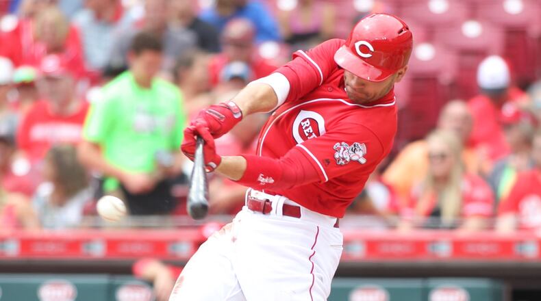 The Reds' Joey Votto swings during a game against the Pirates on Sunday, July 22, 2018, at Great American Ball Park in Cincinnati.