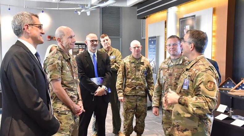Maj. Gen. William Cooley (right), Air Force Research Laboratory commander, and Timothy Sakulich (left), AFRL Materials and Manufacturing Director, join other AFRL officials in welcoming Gen. James M. ‘Mike’ Holmes, Air Combat Command commander, during his recent visit to the Materials and Manufacturing Directorate. (U.S. Air Force photo/Spencer Deer)