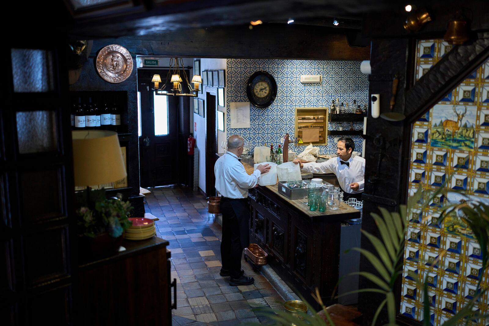 Waiters work at Casa Pedro restaurant in Madrid, Spain, on May 16, 2025. (AP Photo/Manu Fernandez)