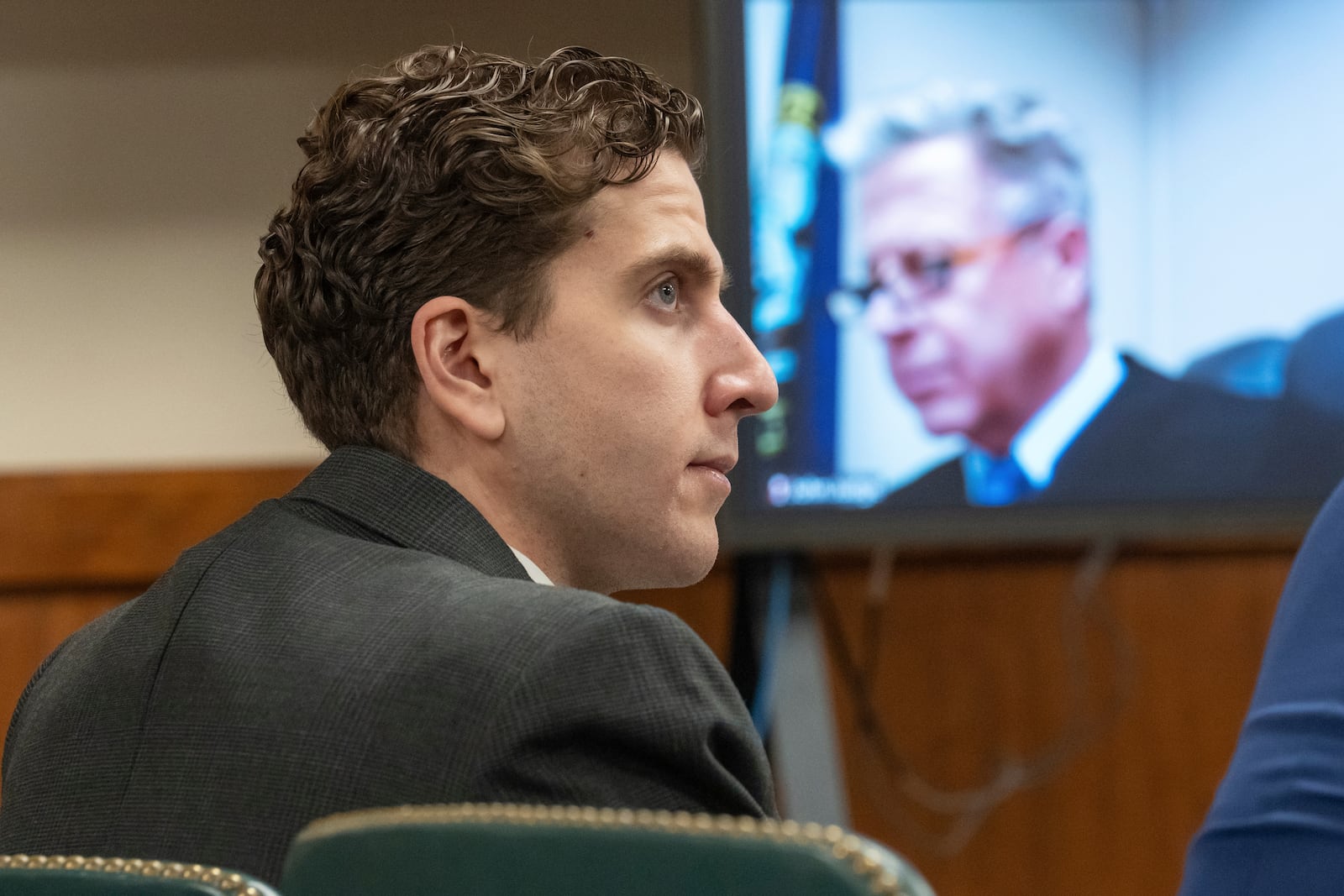 FILE - Bryan Kohberger, left, who is accused of killing four University of Idaho students in November 2022, appears at a hearing in Latah County District Court, Sept. 13, 2023, in Moscow, Idaho, as Second District Judge John C. Judge, seen on a video display, presides over the hearing. (AP Photo/Ted S. Warren, Pool, File)