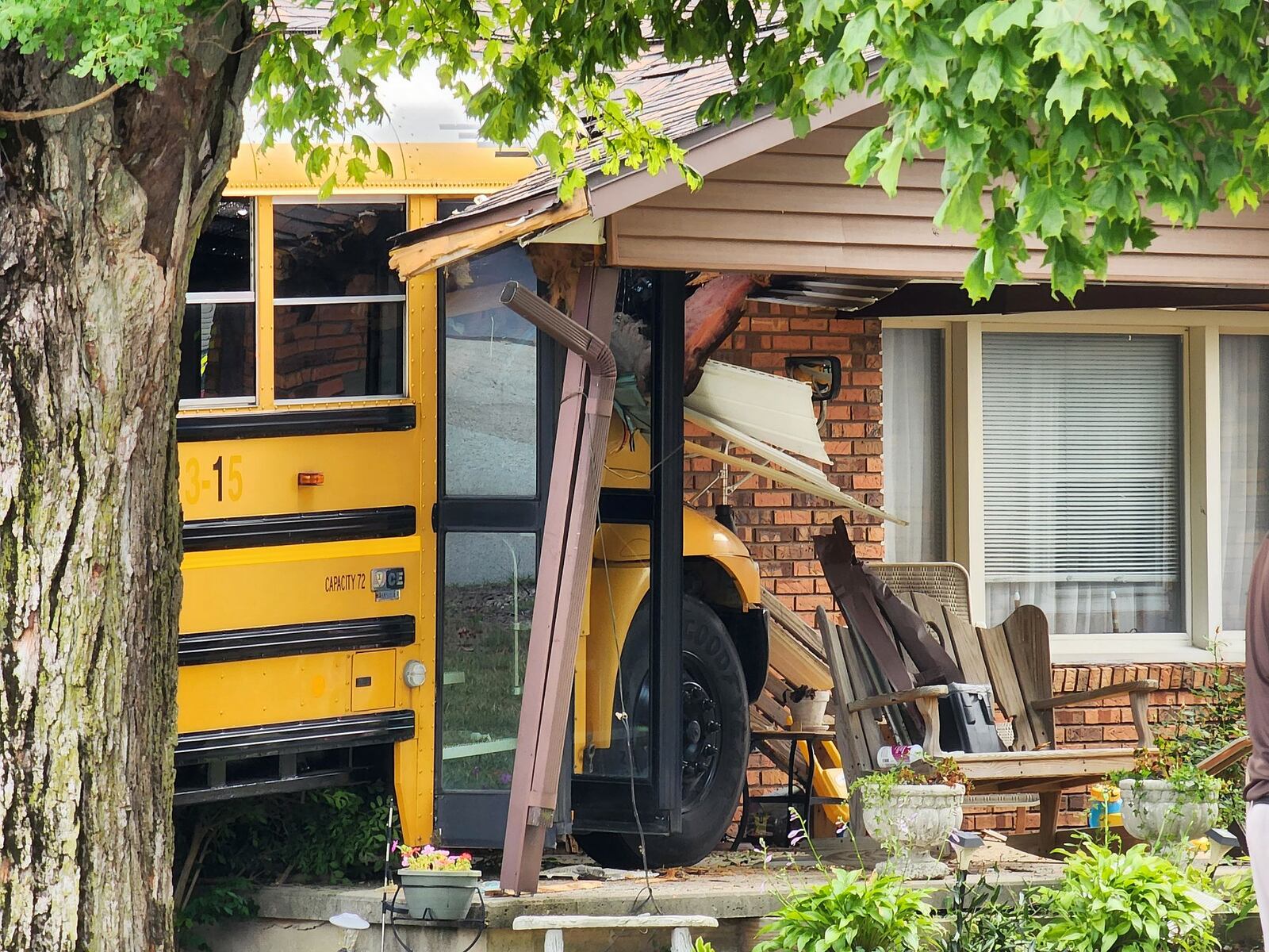 A school bus crashed into a house on Indiana Street in College Corner on Aug. 15, 2022. NICK GRAHAM/STAFF
