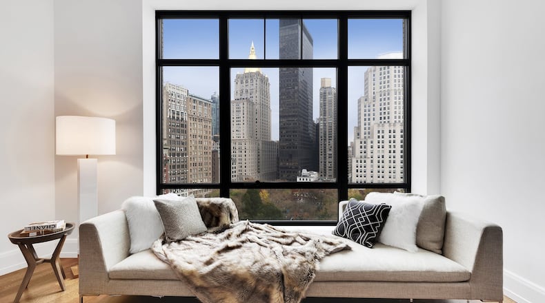 Two chaise pieces are placed together to create a single low sofa. (Design Recipes)