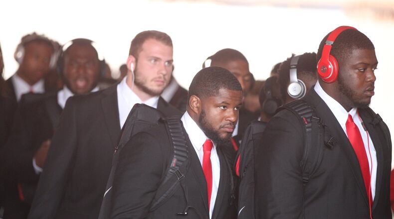 Ohio State players, including Mike Weber, center, arrive at Memorial Stadium before a game against Indiana on Thursday, Aug. 31, 2017, in Bloomington, Ind. David Jablonski/Staff