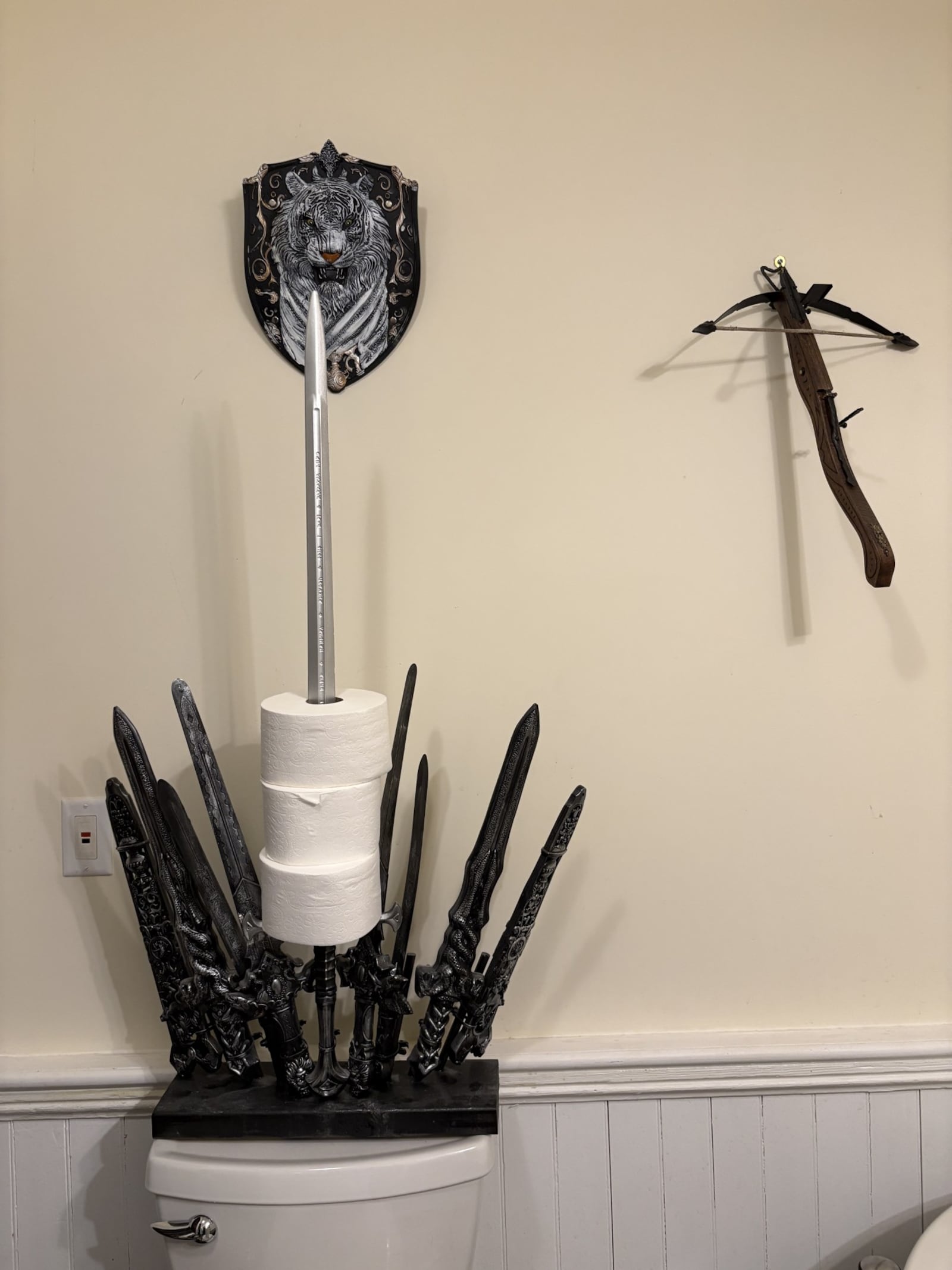 "The Throne of Rolls" sits on the back of the toilet in one of the bathrooms. Kim Queener has turned an old Brookville schoolhouse into a medieval-themed home. CONTRIBUTED
