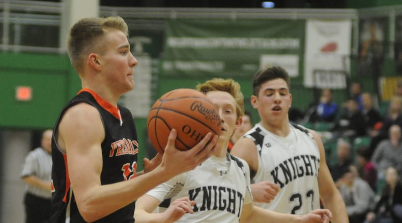Versailles’ Justin Ahrens (with ball) was named a D-III All-Ohio co-player of the year. MARC PENDLETON / STAFF