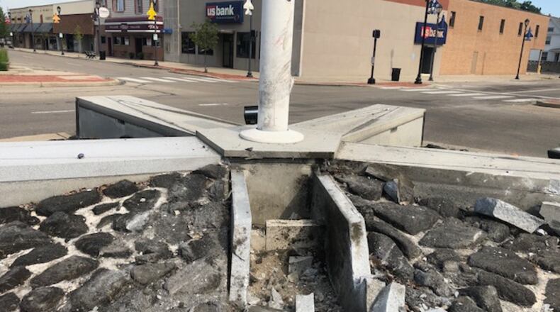 One person was taken to the hospital after a vehicle crashed into the Fairborn Veterans Memorial in downtown early Saturday morning, police said. NICK BLIZZARD/STAFF