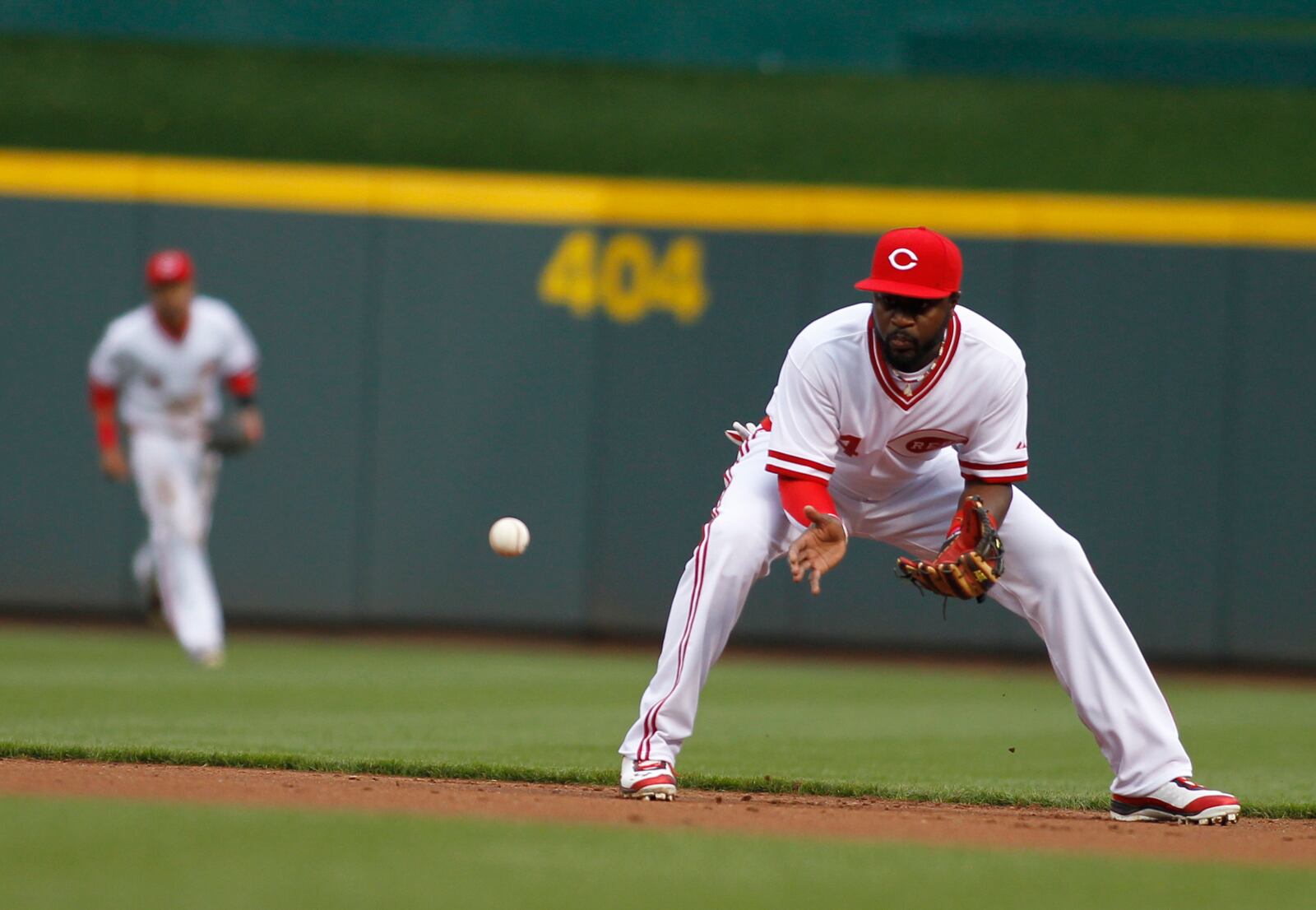Reds second baseman Brandon Phillips fields a groundball against the Cubs on Friday, April 24, 2015, at Great American Ball Park in Cincinnati. David Jablonski/Staff