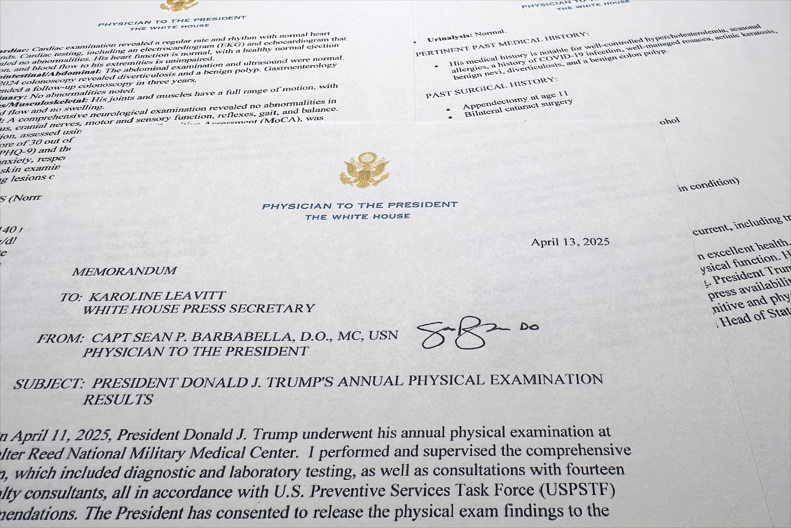 The report on President Donald Trump's health after his physical on April 11, 2025, at Walter Reed National Military Medical Center, released by the White House on behalf of his physician Navy Capt. Sean Barbabella, is photographed Sunday, April 13, 2025. (AP Photo/Jon Elswick)