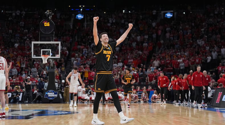 Iowa forward Alvaro Folgueiras (7)celebrates after defeating Nebraska in the Sweet 16 of the NCAA college basketball tournament Thursday, March 26, 2026, in Houston. (AP Photo/Eric Gay)