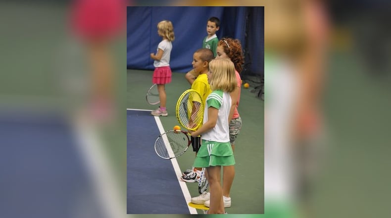 Children get a head start on their tennis games in the Quickstart junior tennis program at the Five Seasons Family Sports Club. CONTRIBUTED PHOTO