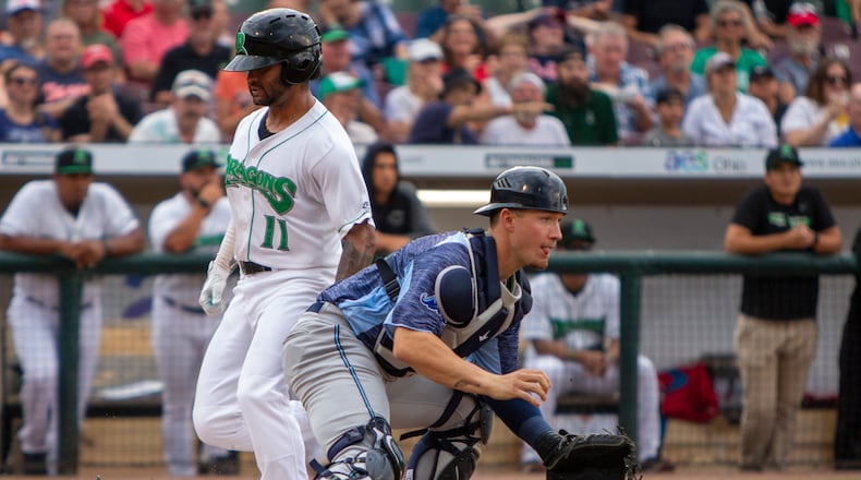 Dayton's Quin Cotton scores on a single by Victor Ruiz for a 3-0 Dragons' lead in the first inning Wednesday night. Cotton started the scoring with a two-run double. Jeff Gilbert/CONTRIBUTED