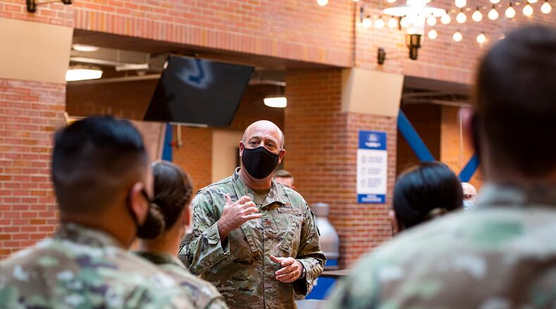 Col. Patrick Miller, 88th Air Base Wing and installation commander, talks with 88th Medical Group Airmen from Wright-Patterson Air Force Base deployed to the community vaccination center at Ford Field in Detroit during his site visit May 3. The Ford Field CVC is designed to vaccinate up to 6,000 community members a day. U.S. AIR FORCE PHOTO/WESLEY FARNSWORTH