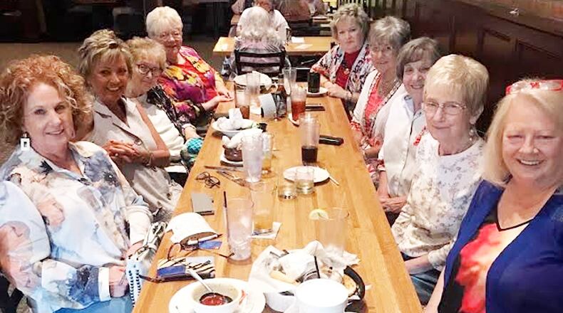 Ruth Addison (from left), Penny Lange, Carol Gainey, Janice Studebaker, Judy Halsall, Faye Fetters, Gretchen Locke, Patti Anderson and Kip Gibson enjoy dinner recently. CONTRIBUTED