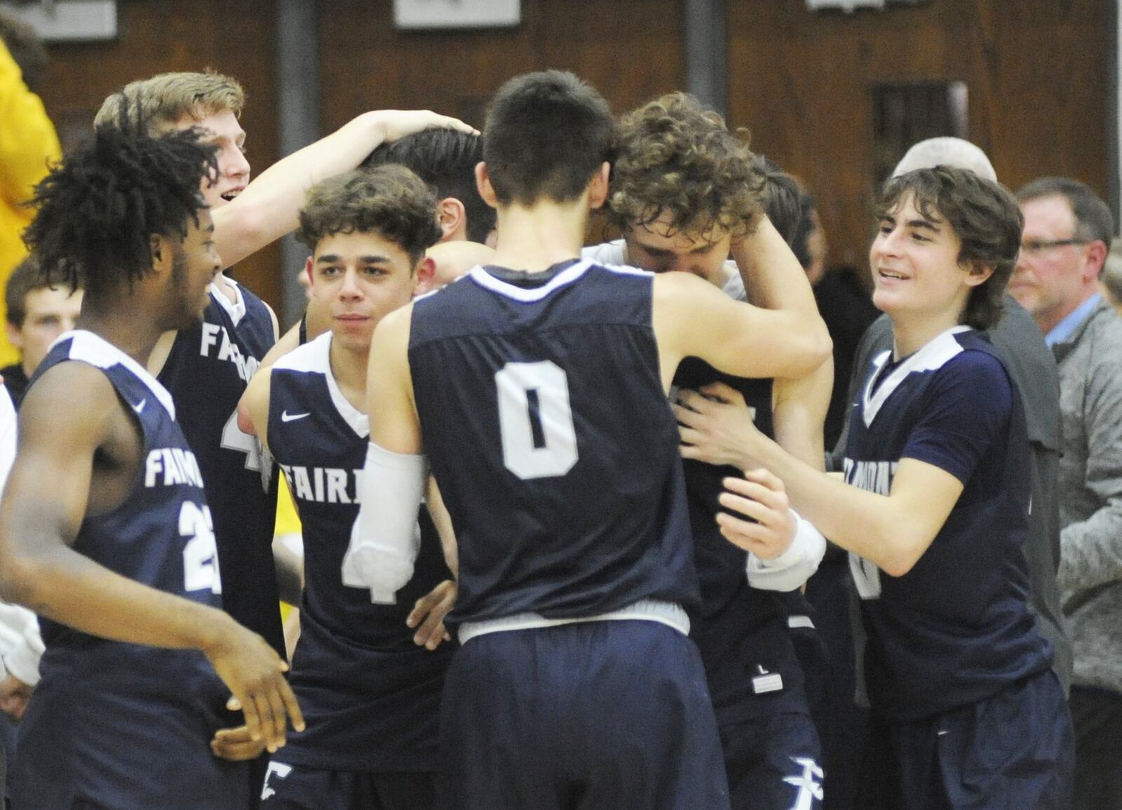 Fairmont celebrates, including Ryan Hall (0) and Kellan Bochenek. Fairmont defeated Wayne 51-43 in a boys high school basketball D-I sectional final at Centerville on Monday, March 4, 2019. MARC PENDLETON / STAFF