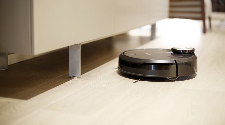 The Deebot (13.9-by-13.9-by-4 inches, 10.6 pounds) has left and right handed rotor brushes to help get most everything in its way. (www.ecovacs.com)