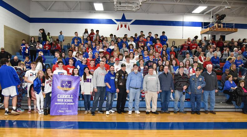Carroll High School honored U.S. military veterans with a special ceremony at the boys basketball game on Jan. 17. Carroll also announced it had received the Ohio Department of Education s Purple Star designation for being a military-friendly school as part of the ceremony. Easterling Studios photo