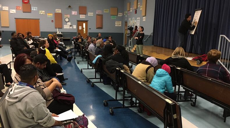 Dayton residents and school officials participate in a sparsely attended town hall meeting Dec. 13, 2018, aimed at increasing family engagement in Dayton Public Schools. JEREMY P. KELLEY / STAFF
